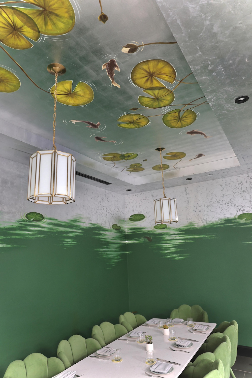 Designed by Bland Design, a silver gilded ceiling, painted with beautiful water lilies and Koi. Showing the movement of the water, looking like a reflection of a lake.